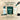 Hona Fiber + Greens packaging with a hand pouring a packet into a shaker, on a white background.